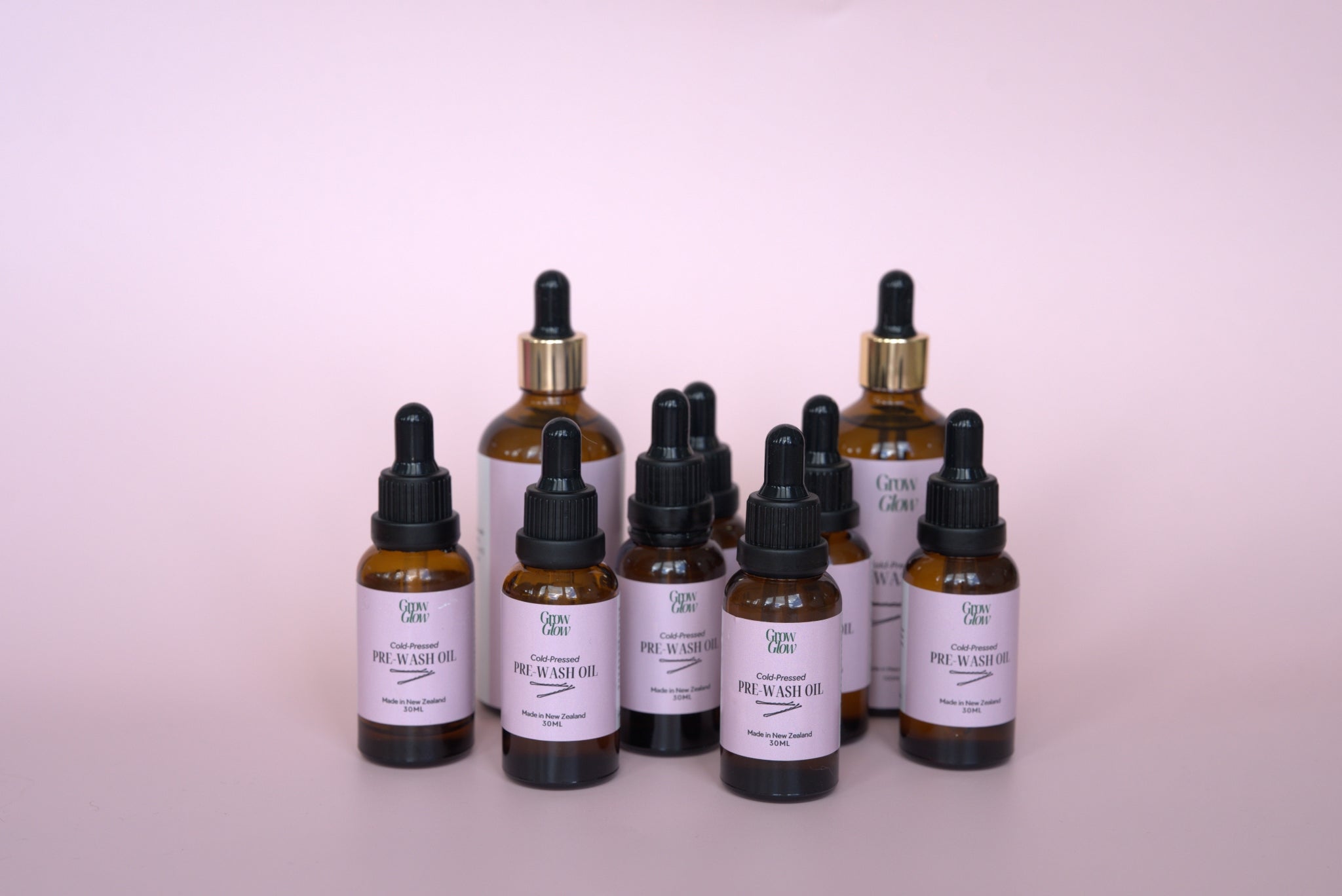 Bottles of natural Grow Glow Hair and Scalp Oil. Our Scalp oil contains no harsh ingredients.