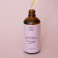 Bottle of natural Grow Glow Hair and Scalp Oil. Our Scalp oil contains no harsh ingredients.